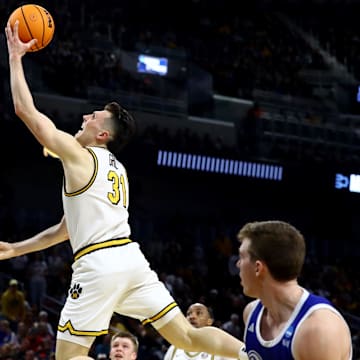 Mar 20, 2025; Wichita, KS, USA; Missouri Tigers guard Caleb Grill (31) shoots against Drake Bulldogs guard Mitch Mascari (22) in the first half of a first round men’s NCAA Tournament game at Intrust Bank Arena. Mandatory Credit: Nick Tre. Smith-Imagn Images
