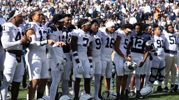 Penn State football players sing their alma-mater following the conclusion of the Blue-White Game at Beaver Stadium. 