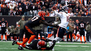 Cincinnati Bengals defensive tackle T.J. Slaton Jr. (98) and Cincinnati Bengals defensive end Shemar Stewart (97) force Chicago Bears quarterback Caleb Williams (18) to throw the ball away in the second quarter of the NFL football game between Chicago Bears and Cincinnati Bengals at Paycor Stadium in Cincinnati on Nov. 2, 2025.