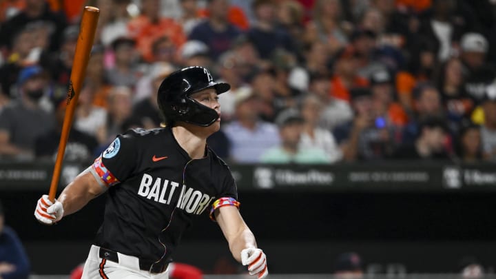 Aug 16, 2024; Baltimore, Maryland, USA;  Baltimore Orioles second baseman Jackson Holliday (7) hits a third inning triple against the Boston Red Sox at Oriole Park at Camden Yards. 