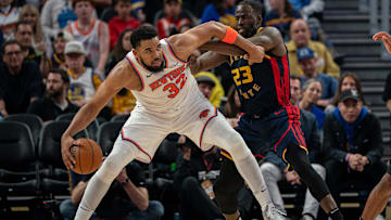 Mar 15, 2025; San Francisco, California, USA; New York Knicks center Karl-Anthony Towns (32) controls the basketball against Golden State Warriors forward Draymond Green (23) during the third quarter at Chase Center. Mandatory Credit: Neville E. Guard-Imagn Images