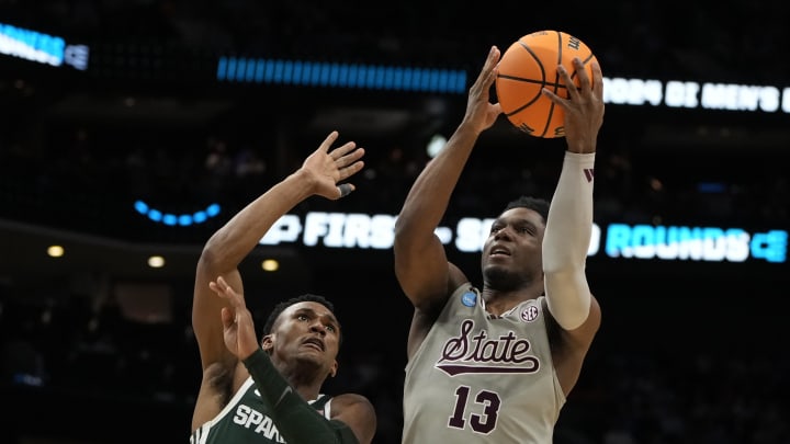 March 21, 2024, Charlotte, NC, USA; Mississippi State Bulldogs guard Josh Hubbard (13) shoots over Michigan State Spartans guard Tyson Walker (2) in the first round of the 2024 NCAA Tournament at the Spectrum Center. Mandatory Credit: Bob Donnan-USA TODAY Sports
