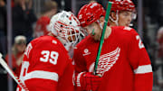 Oct 15, 2025; Detroit, Michigan, USA;  Detroit Red Wings goaltender Cam Talbot (39) and left wing James van Riemsdyk (21) celebrate after defeating the Florida Panthers at Little Caesars Arena. Mandatory Credit: Rick Osentoski-Imagn Images
