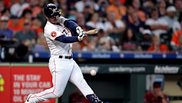 Sep 7, 2024; Houston, Texas, USA; Houston Astros third baseman Alex Bregman (2) hits an RBI infield single against the Arizona Diamondbacks during the sixth inning at Minute Maid Park. 