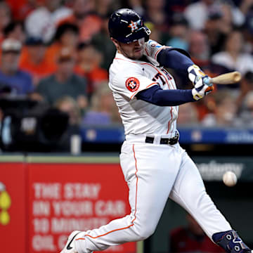 Sep 7, 2024; Houston, Texas, USA; Houston Astros third baseman Alex Bregman (2) hits an RBI infield single against the Arizona Diamondbacks during the sixth inning at Minute Maid Park. 