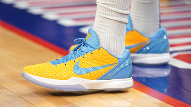 Anthony Davis's blue and gold Nike sneakers.