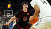 Mar 13, 2024; Las Vegas, NV, USA; Stanford Cardinal forward Maxime Raynaud (42) defends against California Golden Bears forward Grant Newell (14) during the second half at T-Mobile Arena. Mandatory Credit: Stephen R. Sylvanie-Imagn Images