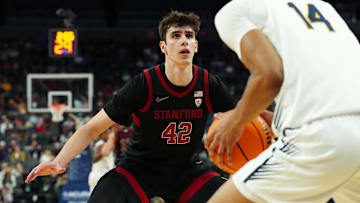 Mar 13, 2024; Las Vegas, NV, USA; Stanford Cardinal forward Maxime Raynaud (42) defends against California Golden Bears forward Grant Newell (14) during the second half at T-Mobile Arena. Mandatory Credit: Stephen R. Sylvanie-Imagn Images