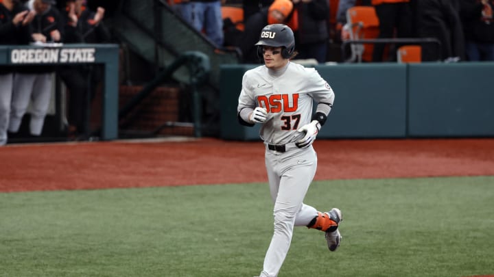 Jun 12, 2022; Corvallis, OR, USA; Oregon State Beavers infielder Travis Bazzana (37) runs the bases after hitting a home run against the Auburn Tigers in the 4th inning  during Game 2 of a NCAA Super Regional game at Coleman Field. Mandatory Credit: Soobum Im-USA TODAY Sports