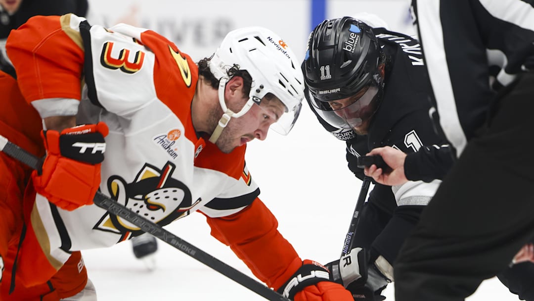 Feb 8, 2025; Los Angeles, California, USA; Los Angeles Kings center Anze Kopitar (11) prepares for a face off against Anaheim Ducks center Mason McTavish (23) during the second period of a hockey game at Crypto.com Arena. Mandatory Credit: Jessica Alcheh-Imagn Images
