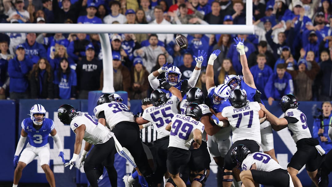 Nov 15, 2025; Provo, Utah, USA; Texas Christian University Horned Frogs kicker Nate McCashland (99) kicks a field goal held by Texas Christian University Horned Frogs kicker Easton Black (97) during the second quarter of the game against the BYU Cougars at LaVell Edwards Stadium. Mandatory Credit: Rob Gray-Imagn Images