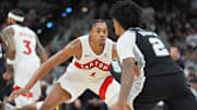 Toronto Raptors forward/guard Scottie Barnes defends San Antonio Spurs guard Dylan Harper.