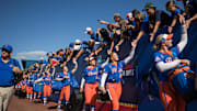 May 30, 2025; Oklahoma City, OK, USA;  Florida Gators pitcher Katelynn Oxley (39) and infielder Mia Williams (11) along with their teammates, enter the stadium and greet the fans before their game against the Tennessee Lady Volunteers in the NCAA Softball Women's College World Series at Devon Park. Mandatory Credit: Brett Rojo-Imagn Images