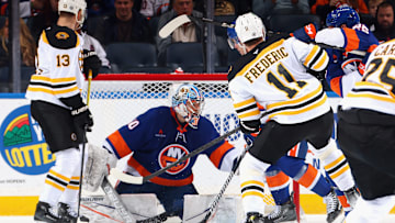 The Boston Bruins exploded for three goals in the last minutes to hand the New York Islanders another disappointing loss. 