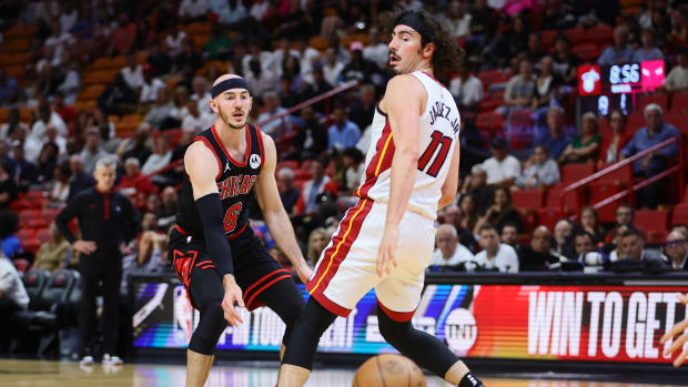 Apr 19, 2024; Miami, Florida, USA; Chicago Bulls guard Alex Caruso (6) passes the basketball as Miami Heat guard Jaime Jaquez Jr. (11) defends in the first quarter during a play-in game of the 2024 NBA playoffs at Kaseya Center. Mandatory Credit: Sam Navarro-USA TODAY Sports