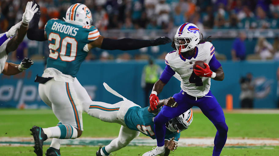 Buffalo Bills running back James Cook (4) runs with the football against Miami Dolphins cornerback Jalen Ramsey (5) during the second quarter at Hard Rock Stadium last season. | Sam Navarro-Imagn Images