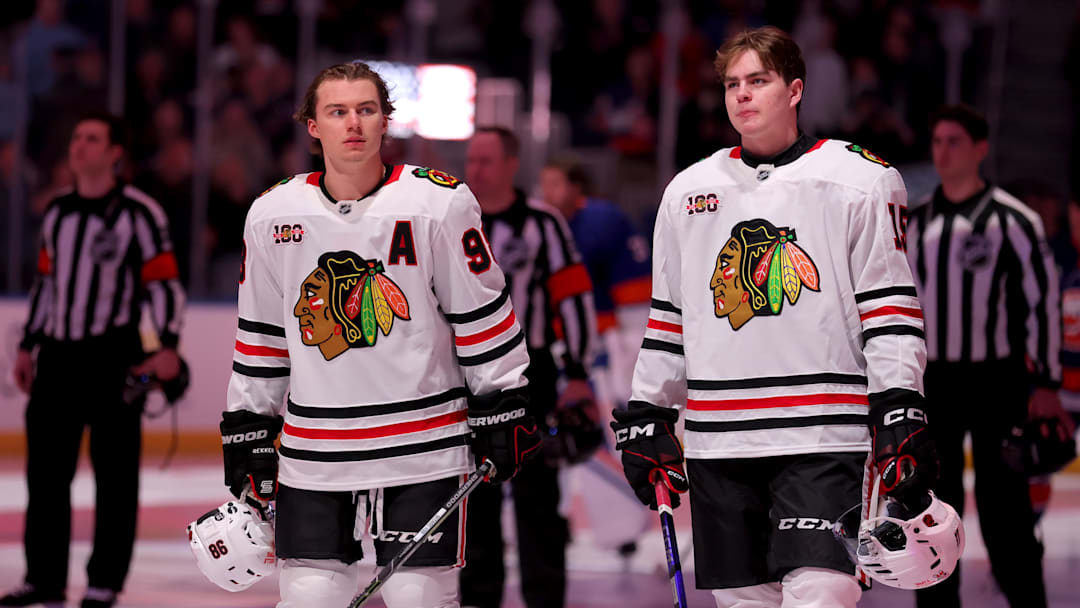 Mar 24, 2026; Elmont, New York, USA; Chicago Blackhawks centers Connor Bedard (98) and Anton Frondell (15) stand for the US national anthem before a game against the New York Islanders at UBS Arena. Mandatory Credit: Brad Penner-Imagn Images