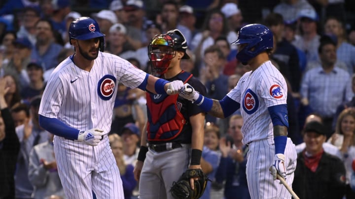 Jun 22, 2021; Chicago, Illinois, USA;  Chicago Cubs first baseman Kris Bryant (left) fist bumps shortstop Javier Baez (9) after hitting a home run against the Cleveland Indians during the fourth inning at Wrigley Field.