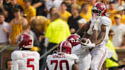 Oct 11, 2025; Columbia, Missouri, USA; Alabama Crimson Tide running back Daniel Hill (4) celebrates his touchdown against the Missouri Tigers during the second half of the game at Faurot Field at Memorial Stadium. Mandatory Credit: Jay Biggerstaff-Imagn Images