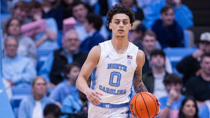 Dec 22, 2025; Chapel Hill, North Carolina, USA; North Carolina Tar Heels guard Kyan Evans (0) brings the ball up court against the East Carolina Pirates during the second half at Dean E. Smith Center. Mandatory Credit: Scott Kinser-Imagn Images