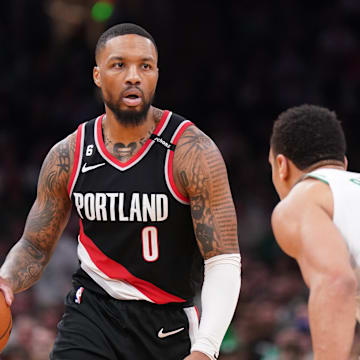 Mar 8, 2023; Boston, Massachusetts, USA; Portland Trail Blazers guard Damian Lillard (0) dribbles the ball against Boston Celtics forward Jayson Tatum (0) in the second quarter at TD Garden. Mandatory Credit: David Butler II-Imagn Images
