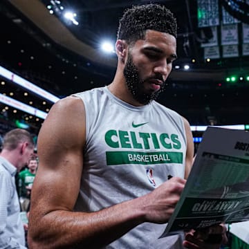 May 23, 2024; Boston, Massachusetts, USA; Boston Celtics forward Jayson Tatum (0) signs autographs after warm up before the start of game two of the eastern conference finals for the 2024 NBA playoffs against the Indiana Pacers at TD Garden. Mandatory Credit: David Butler II-Imagn Images