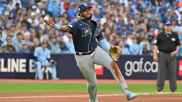 Sep 30, 2023; Toronto, Ontario, CAN;  Tampa Bay Rays third baseman Junior Caminero (1) throws out Toronto Blue Jays first baseman Vladimir Guerrero Jr (not pictured) in the seventh inning at Rogers Centre.