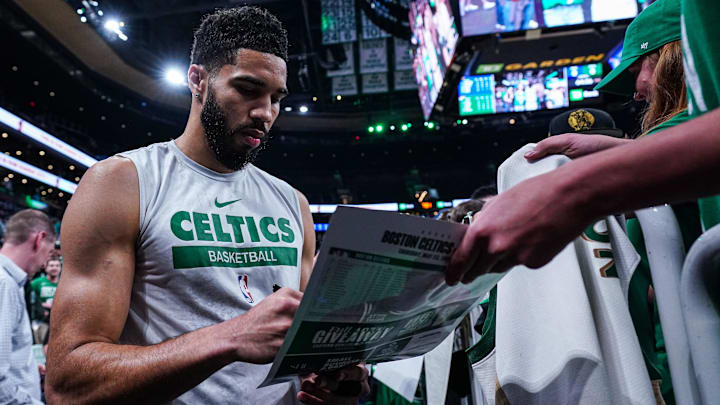 May 23, 2024; Boston, Massachusetts, USA; Boston Celtics forward Jayson Tatum (0) signs autographs after warm up before the start of game two of the eastern conference finals for the 2024 NBA playoffs against the Indiana Pacers at TD Garden. Mandatory Credit: David Butler II-Imagn Images