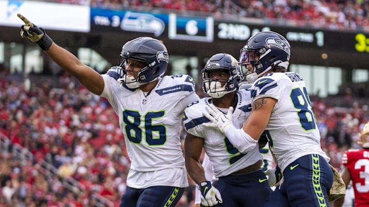 November 17, 2024; Santa Clara, California, USA; Seattle Seahawks running back Kenneth Walker III (9) is congratulated by tight end Pharaoh Brown (86) and tight end AJ Barner (88) for scoring a touchdown against the San Francisco 49ers during the third quarter at Levi's Stadium. Mandatory Credit: Kyle Terada-Imagn Images November 17, 2024; Santa Clara, California, USA; Seattle Seahawks running back Kenneth Walker III (9) is congratulated by tight end Pharaoh Brown (86) and tight end AJ Barner (88) for scoring a touchdown against the San Francisco 49ers during the third quarter at Levi's Stadium. Mandatory Credit: Kyle Terada-Imagn Images