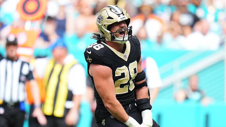Nov 30, 2025; Miami Gardens, Florida, USA; New Orleans Saints linebacker Danny Stutsman (28) reacts after making a tackle against the Miami Dolphins during the first half at Hard Rock Stadium. Mandatory Credit: Rich Storry-Imagn Images