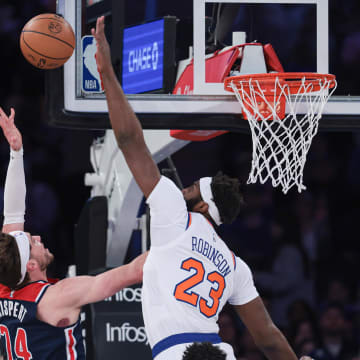 Apr 2, 2023; New York, New York, USA; Washington Wizards forward Corey Kispert (24) scores a basket as New York Knicks center Mitchell Robinson (23) defends  during the first quarter at Madison Square Garden. Mandatory Credit: Vincent Carchietta-USA TODAY Sports