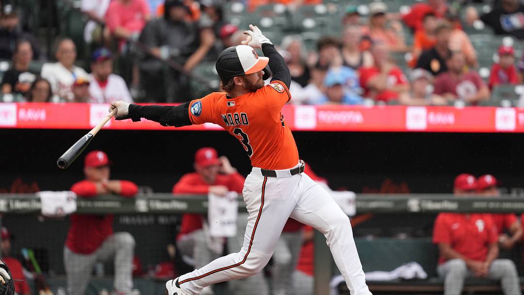 Aug 2, 2026; Baltimore, Maryland, USA; Baltimore Orioles designated hitter Taylor Ward (3) hits a single against the Philadelphia Phillies during the fourth inning at Oriole Park at Camden Yards. Mandatory Credit: Gregory Fisher-Imagn Images