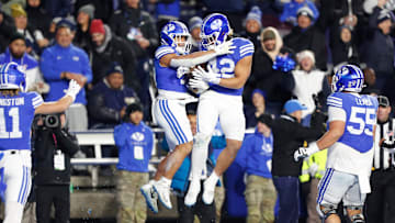 Hinckley Ropati and Ray Paulo celebrate against Kansas