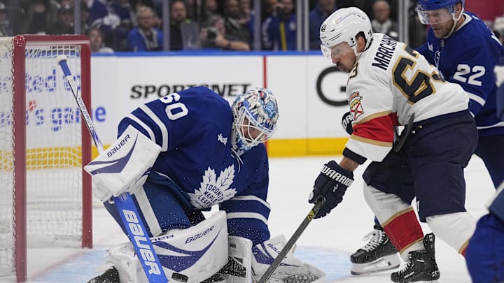 May 14, 2025; Toronto, Ontario, CAN; Toronto Maple Leafs goaltender Joseph Woll (60) makes a save against Florida Panthers forward Brad Marchand (63) during the second period of game five of the second round of the 2025 Stanley Cup Playoffs at Scotiabank Arena. Mandatory Credit: John E. Sokolowski-Imagn Images