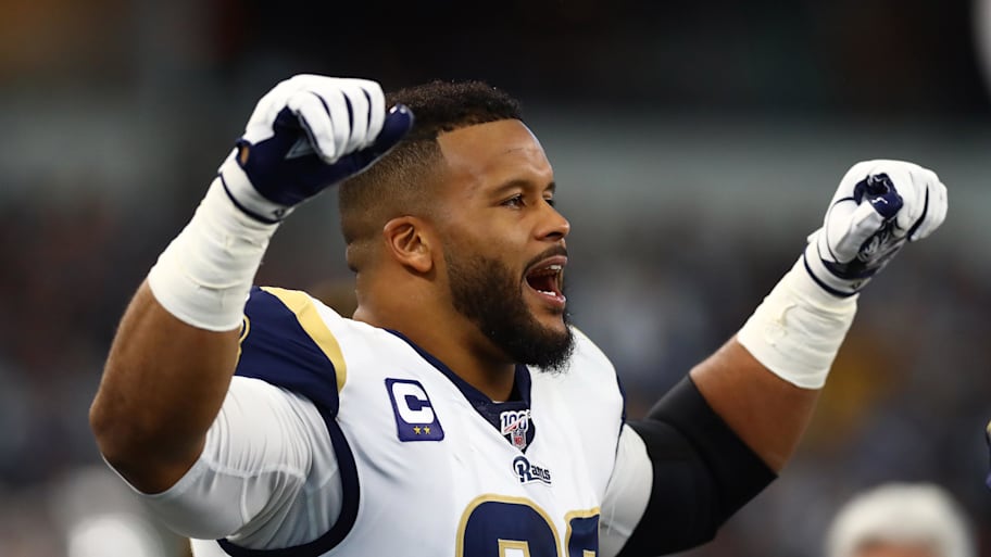 Aaron Donald responded to an edit showing Micah Parsons in a Rams jersey by toying with the idea of returning to the gridiron. | Matthew Emmons-Imagn Images