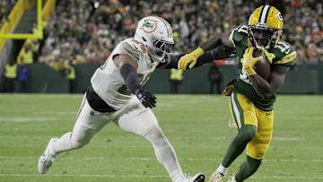 Green Bay Packers wide receiver Jayden Reed outruns Miami Dolphins linebacker Jordyn Brooks