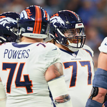 Denver Broncos vs Detroit Lions Denver Broncos guard Quinn Meinerz (77) talks with Denver Broncos offensive tackle Garett Bolles (72) and Denver Broncos guard Ben Powers (74) between plays during an NFL, American Football Herren, USA football game between the Detroit Lions and the Denver Broncos in Detroit, Michigan USA, on Saturday, December 16, 2023. 