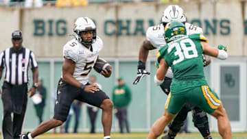 Nov 1, 2025; Waco, Texas, USA; UCF Knights running back Jaden Nixon (5) carries the ball against the Baylor Bears during the second half at McLane Stadium. Mandatory Credit: Raymond Car lin III-Imagn Images