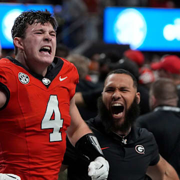 Georgia tight end Oscar Delp (4) celebrates after Georgia won in overtime of the SEC championship game against Texas in Atlanta, on Saturday, Dec. 7, 2024. Georgia won 22-19.