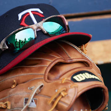 Apr 13, 2017; Detroit, MI, USA; Minnesota Twins hat and glove in the dugout during the game against the Minnesota Twins at Comerica Park. Mandatory Credit: Rick Osentoski-Imagn Images