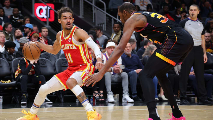 Trae Young of the Atlanta Hawks and Kevin Durant of the  Phoenix Suns