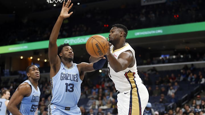 Feb 12, 2024; Memphis, Tennessee, USA; New Orleans Pelicans forward Zion Williamson (1) passes the ball as Memphis Grizzlies forward-center Jaren Jackson Jr. (13) defends during the second half at FedExForum. Mandatory Credit: Petre Thomas-Imagn Images