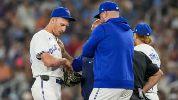 Jun 29, 2024; Toronto, Ontario, CAN; Toronto Blue Jays pitcher Chris Bassitt (40) gets his arm examined by the trainer after being hit with a pitch during the first inning against the New York Yankees at Rogers Centre. Mandatory Credit: Kevin Sousa-USA TODAY Sports