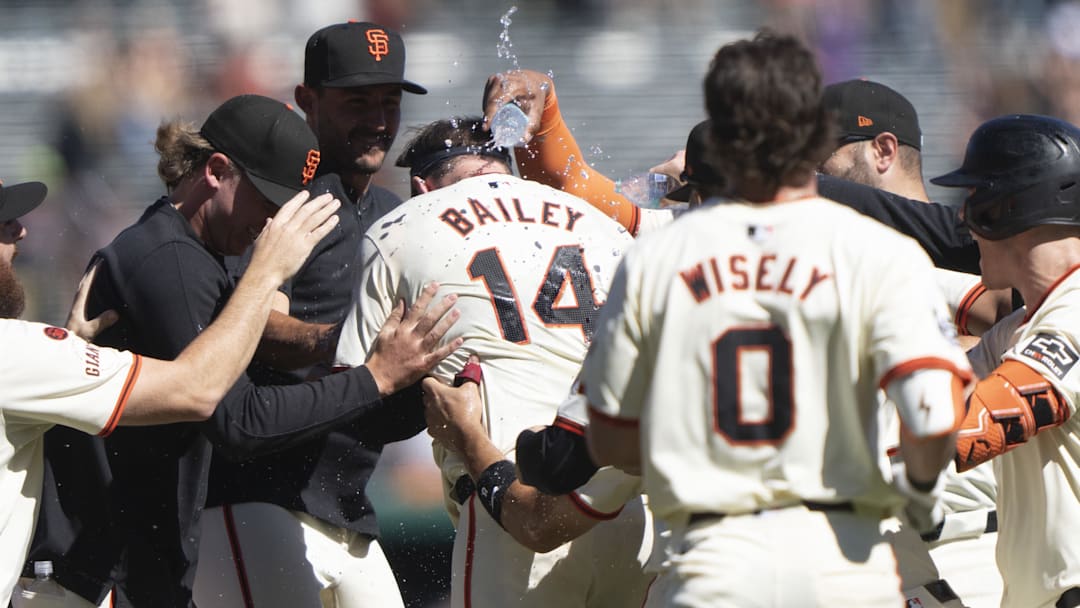 Sep 5, 2024; San Francisco, California, USA;  San Francisco Giants catcher Patrick Bailey (14) celebrates with the team after defeating the Arizona Diamondbacks at Oracle Park.