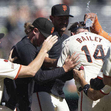 Sep 5, 2024; San Francisco, California, USA;  San Francisco Giants catcher Patrick Bailey (14) celebrates with the team after defeating the Arizona Diamondbacks at Oracle Park.