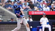 Aug 17, 2025; Toronto, Ontario, CAN; Texas Rangers second baseman Marcus Semien (2) hits a single against the Toronto Blue Jays during the seventh inning at Rogers Centre. 