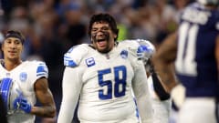 Detroit Lions offensive tackle Penei Sewell (58) reacts.