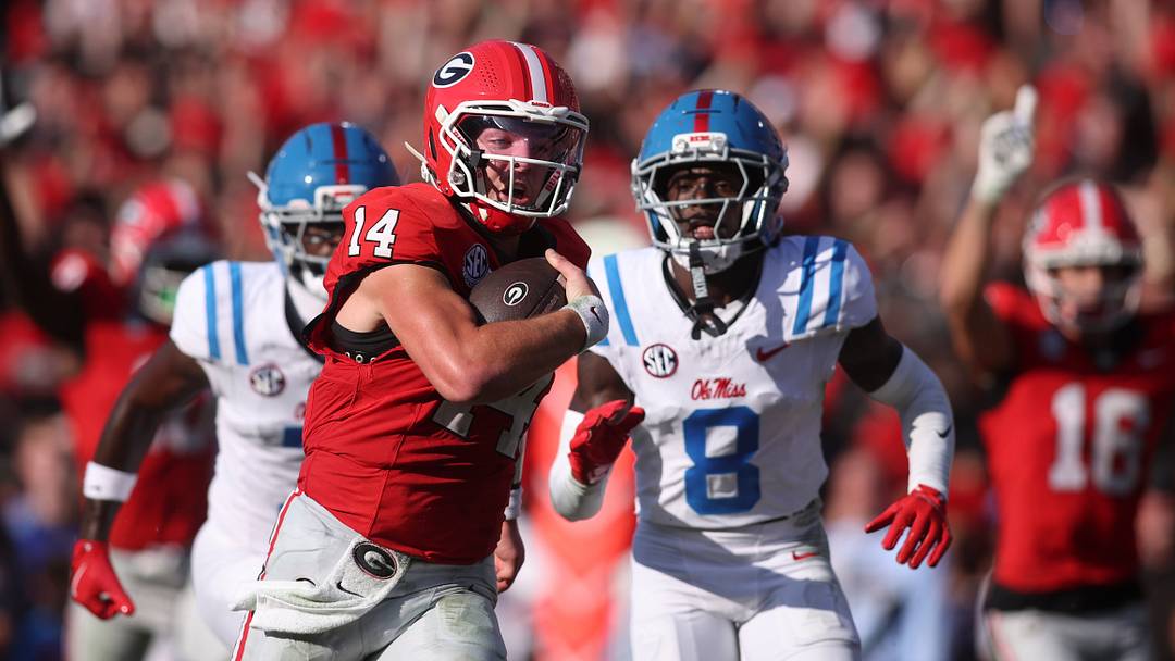 Georgia Bulldogs quarterback Gunner Stockton runs for a touchdown against Mississippi Rebels cornerback Antonio Kite during the second quarter at Sanford Stadium. Georgia Bulldogs quarterback Gunner Stockton runs for a touchdown against Mississippi Rebels cornerback Antonio Kite during the second quarter at Sanford Stadium.