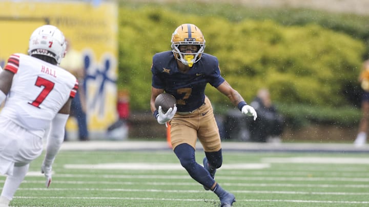 Sep 27, 2025; Morgantown, West Virginia, USA; West Virginia Mountaineers wide receiver Jarod Bowie (7) runs for extra yards after a catch during the first quarter against the Utah Utes at Milan Puskar Stadium. Mandatory Credit: Ben Queen-Imagn Images