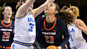 Feb 20, 2025; Los Angeles, California, USA; Illinois Fighting Illini forward Brynn Shoup-Hill (23) tries to score defend by UCLA Bruins forward Angela Dugalic (32) during the second quarter at Pauley Pavilion presented by Wescom. Mandatory Credit: Robert Hanashiro-Imagn Images